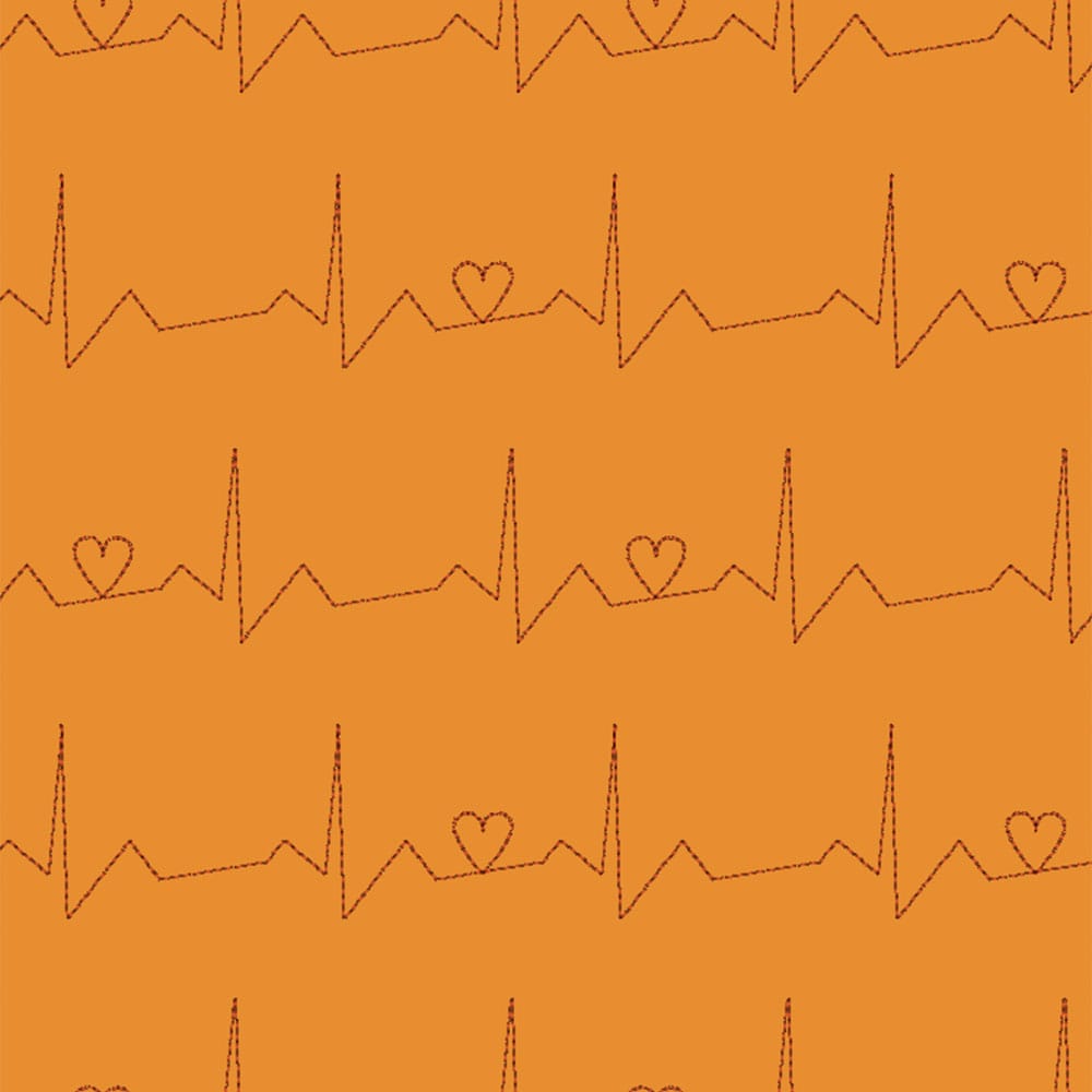 Background quilting design of a EKG interspersed with hearts on an orange background.