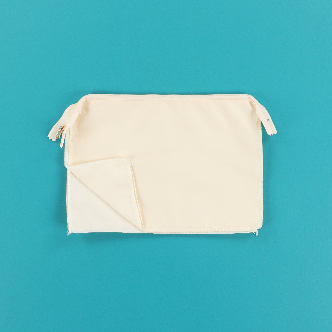 Cream Zipper Pouch Blank on a teal background