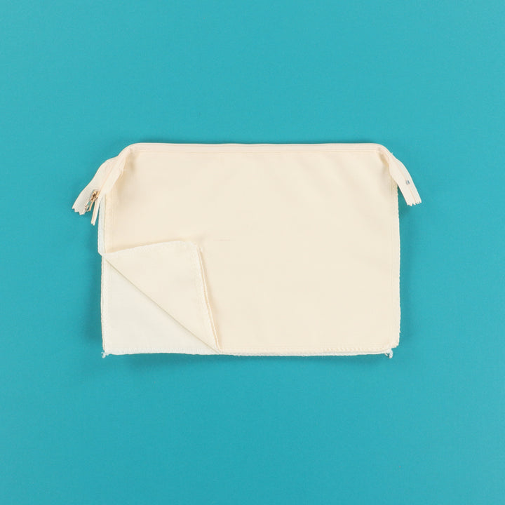 Cream Zipper Pouch Blank on a teal background