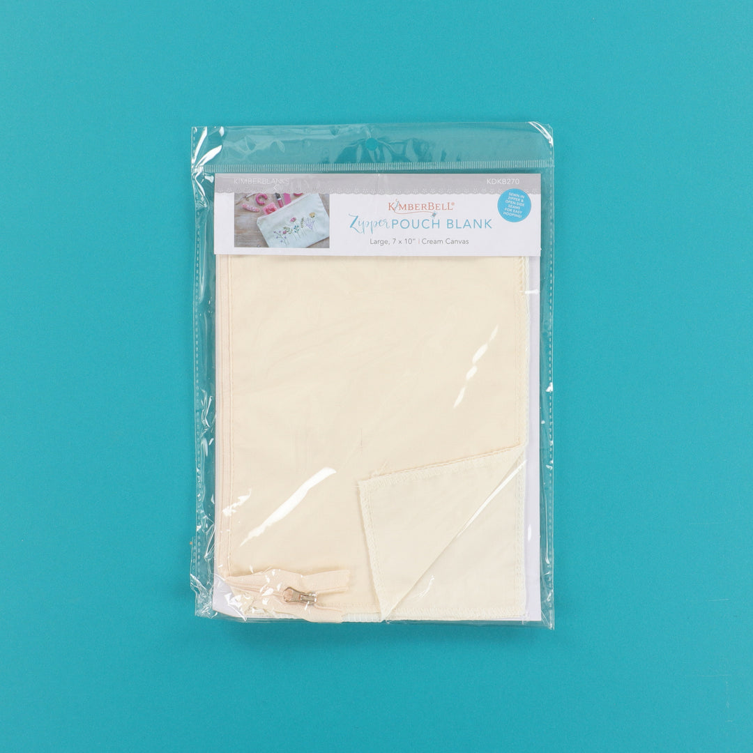 Packaged beige zipper pouch blank on a teal background