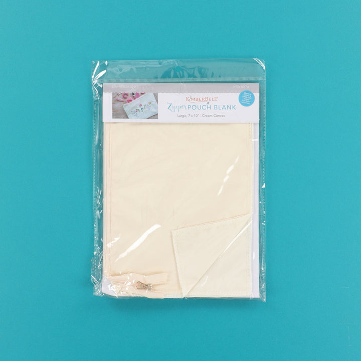 Packaged beige zipper pouch blank on a teal background
