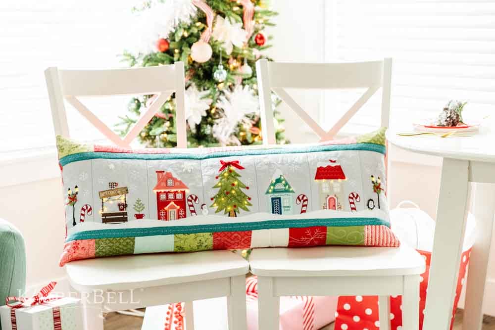 Candy cane lane bench pillow on chairs