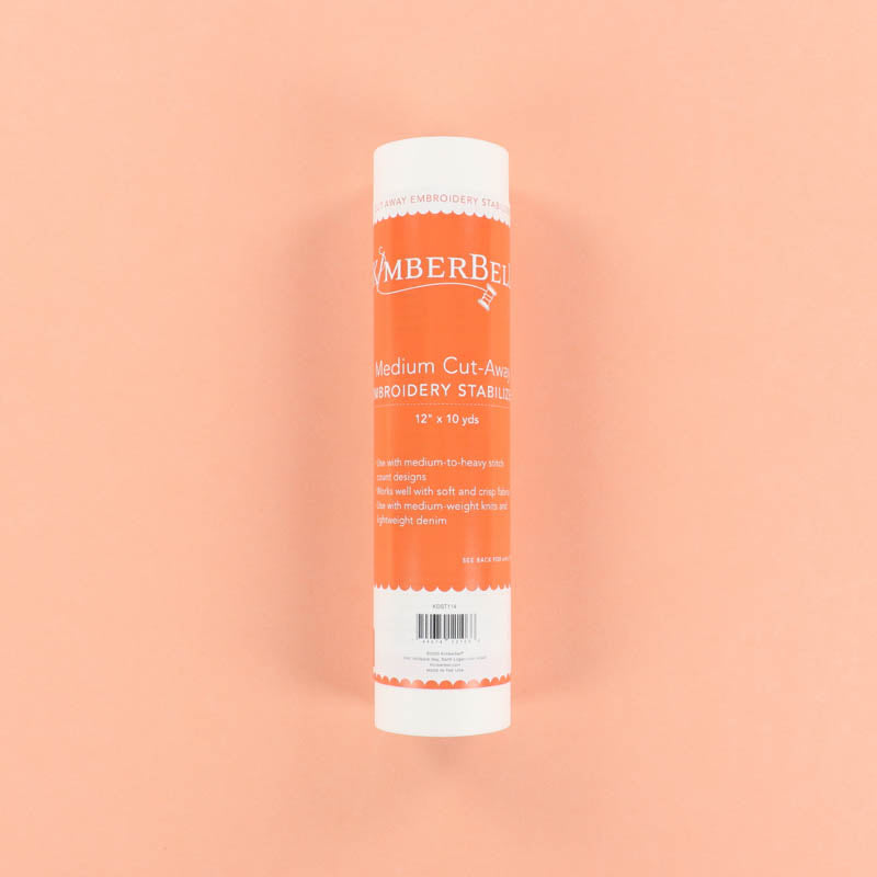 Roll of Medium Cut-Away Stabilizer on a peach background