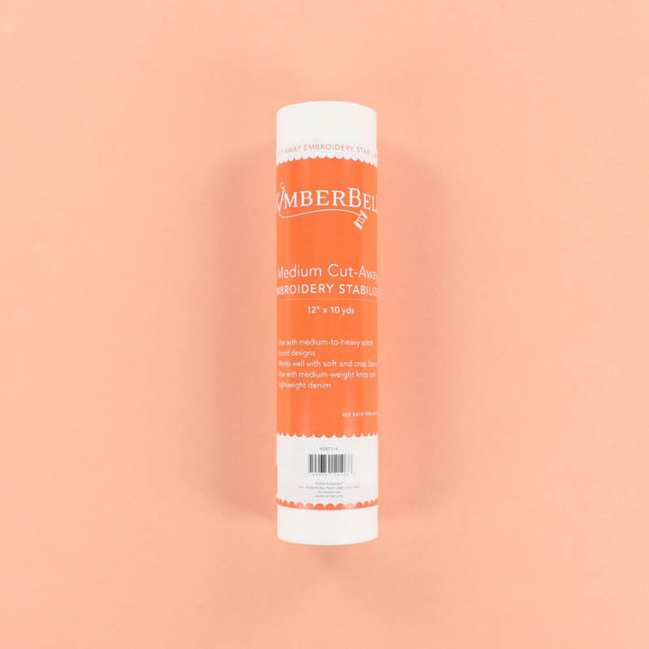 Roll of Medium Cut-Away Stabilizer on a peach background