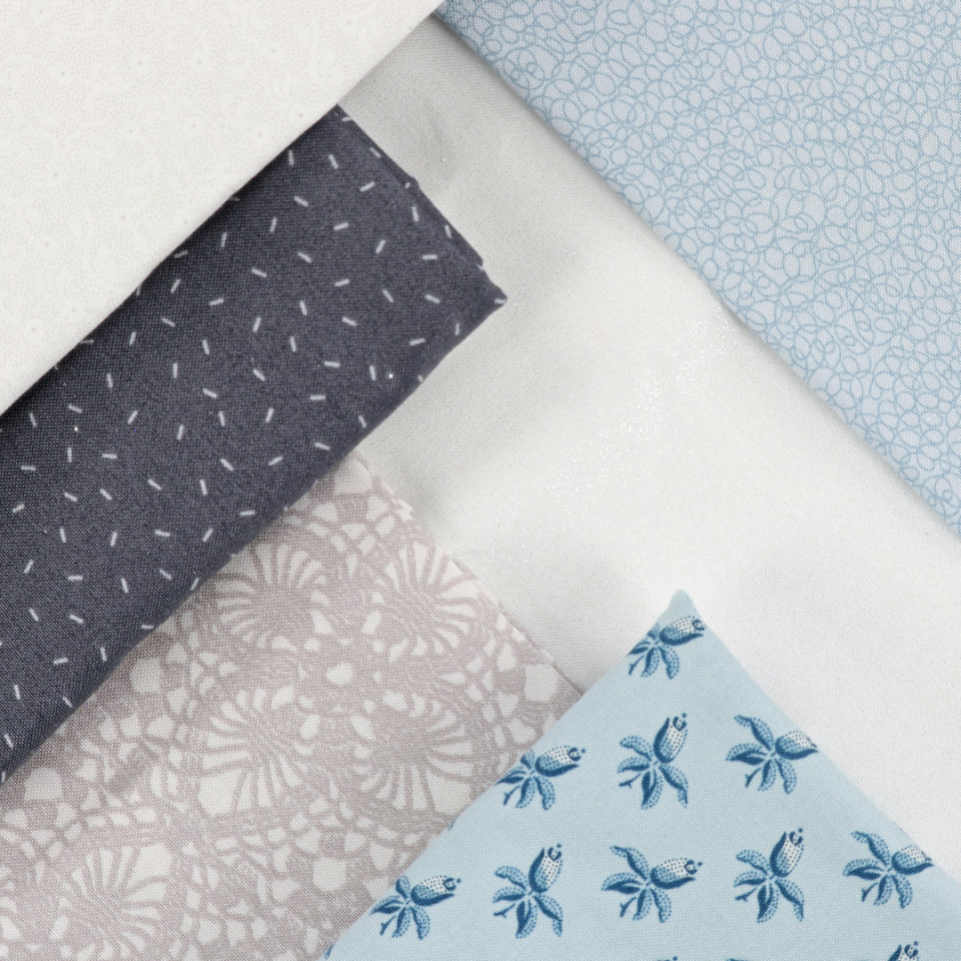 Collection of fabric swatches with various patterns on a light background