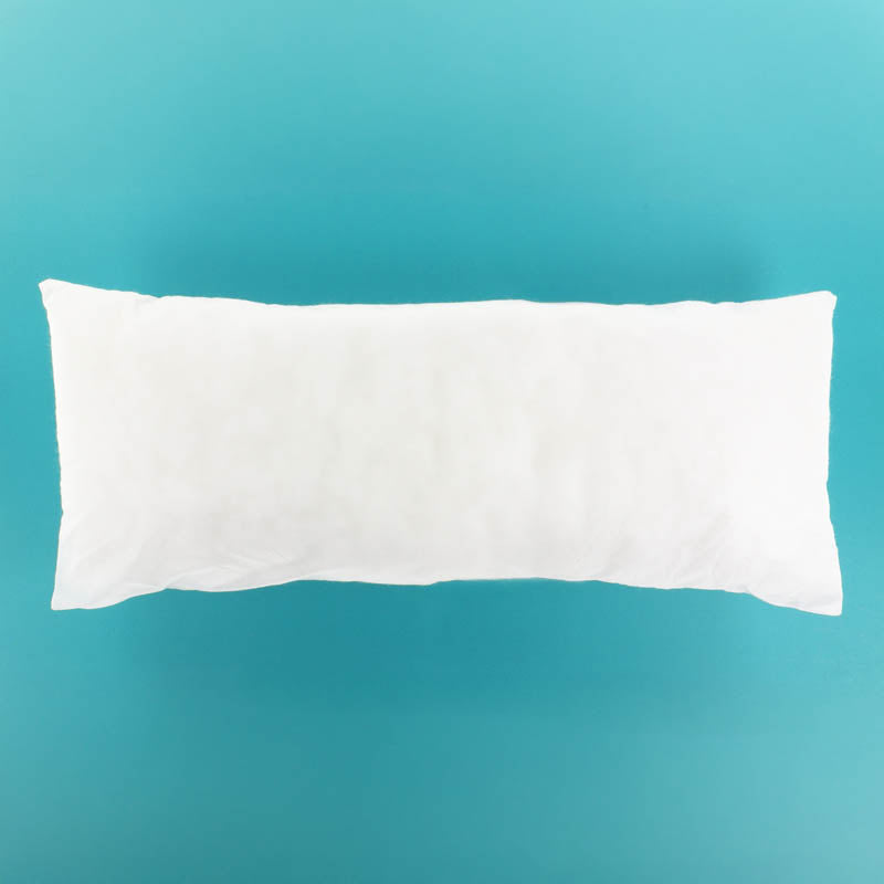 White pillow insert on a teal background
