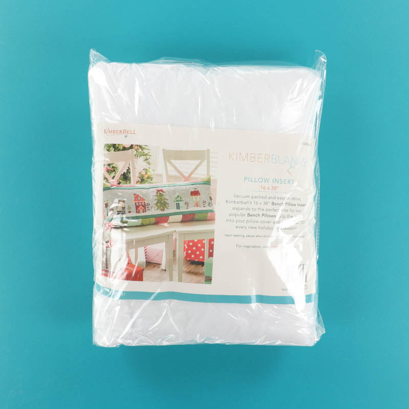 Packaged Kimberbell Pillow Insert on blue background