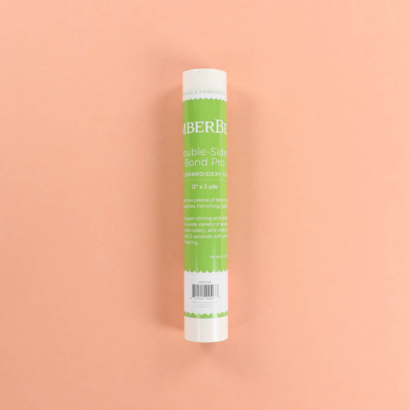 Roll of Kimberbell Double-Sided Bond Pro on a peach background