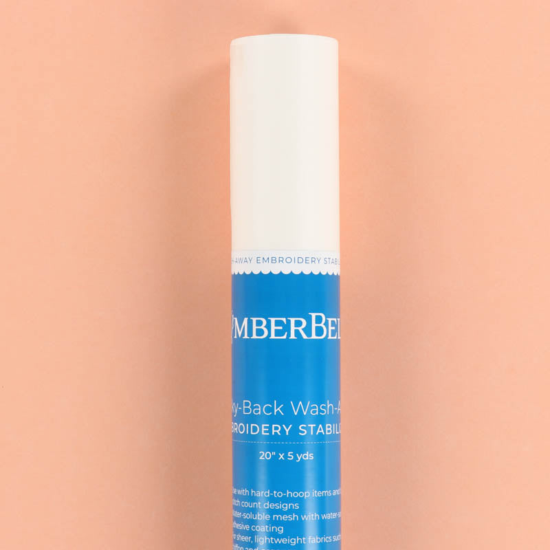 Roll of Kimberbell Sticky-Back Wash-Away on a peach background