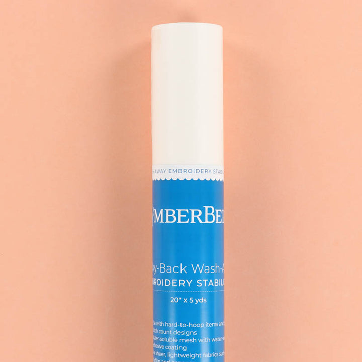 Roll of Kimberbell Sticky-Back Wash-Away on a peach background