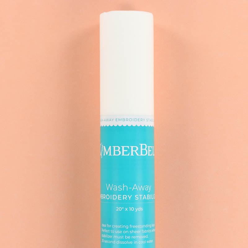 Roll of Kimberbell Wash-Away Stabilizer on a peach background