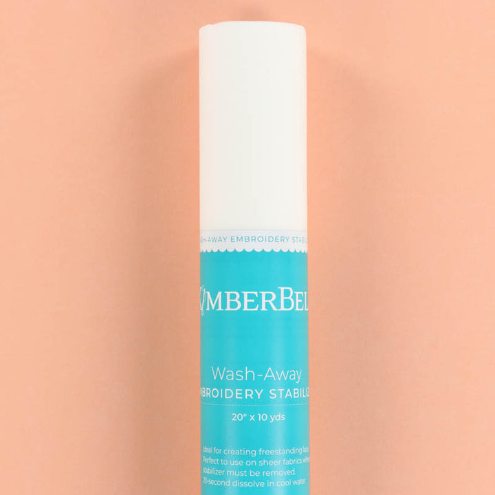 Roll of Kimberbell Wash-Away Stabilizer on a peach background